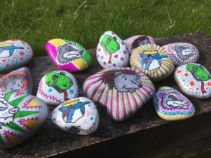 hand painted rocks featuring Robin Hood's Little Outlaws characters